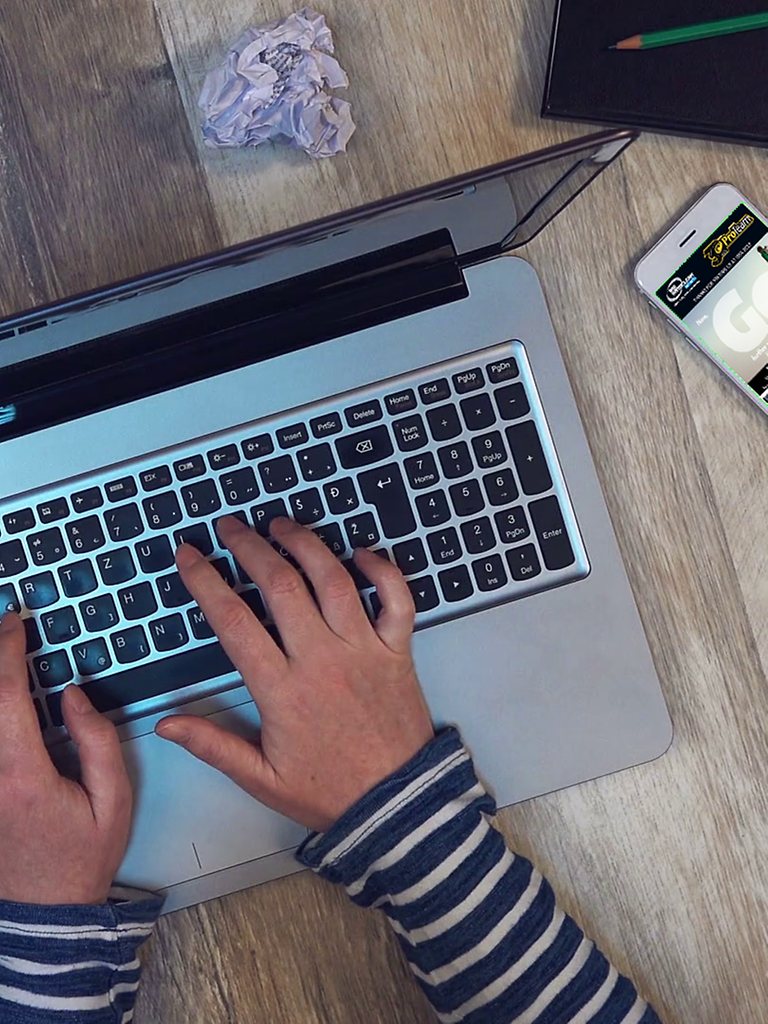 Typing on a laptop